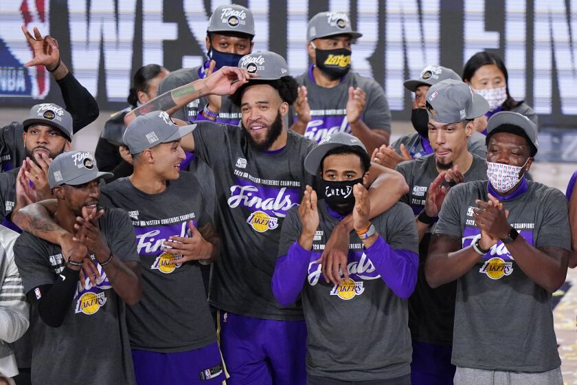 The Los Angeles Lakers celebrate after beating the Denver Nuggets in an NBA conference final.