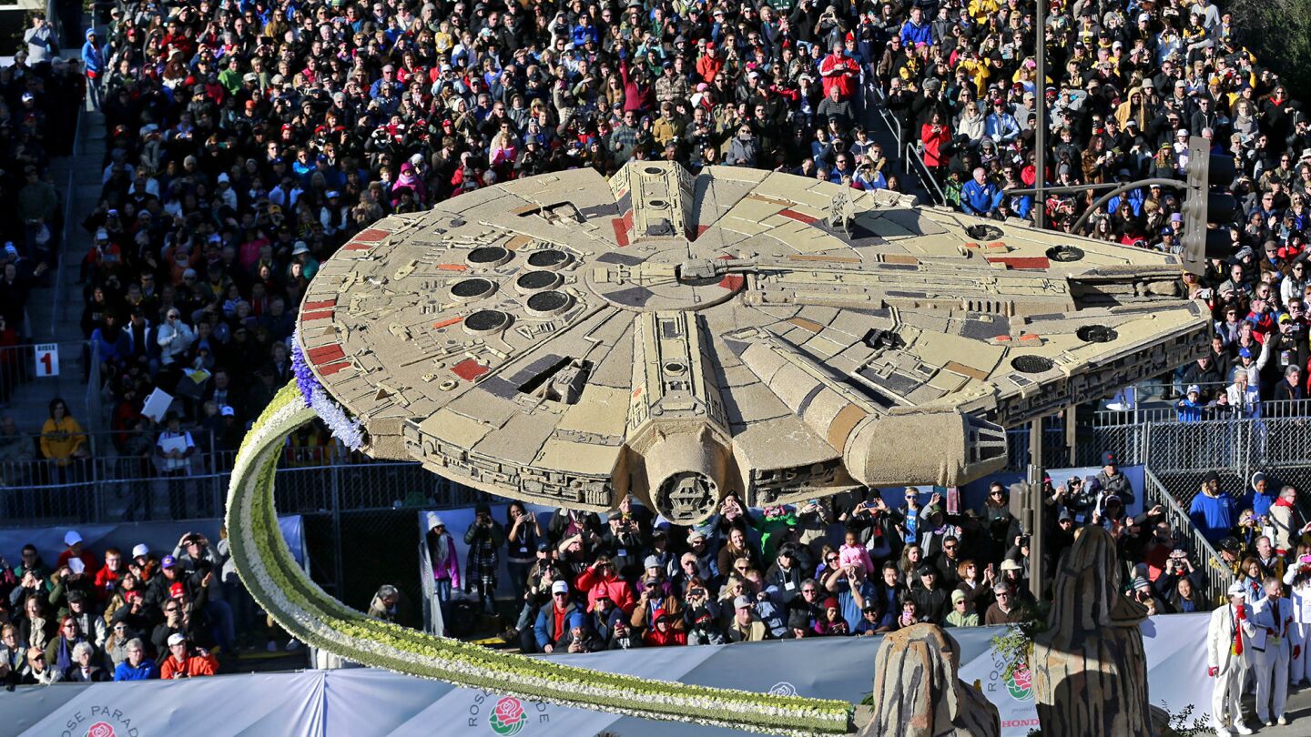 The Millennium Falcon rises over the crowd for Disneyland Resort's “Diamond Celebration” float.