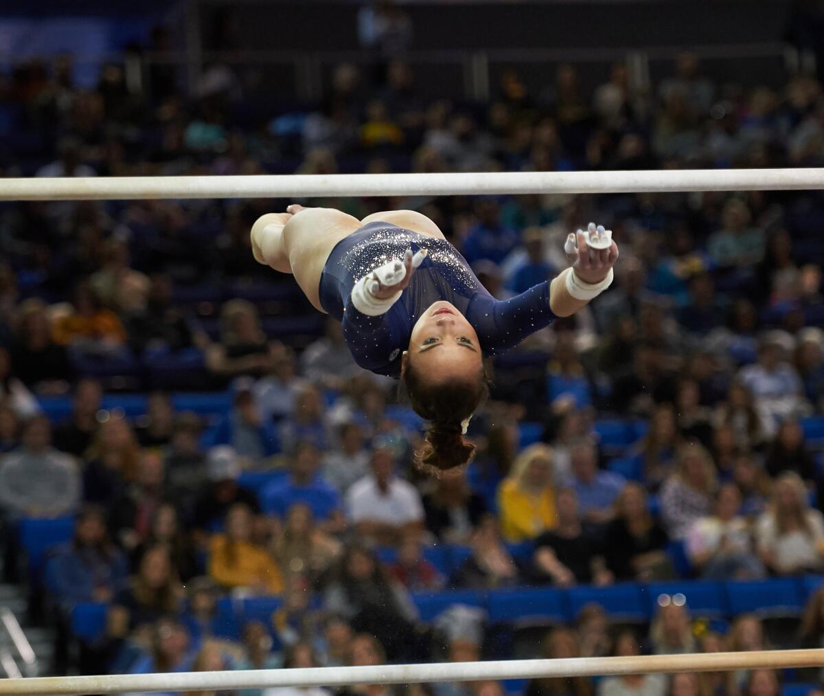 UCLA gymnast Kalyany Steele competes on the uneven bars during the 2020 season.