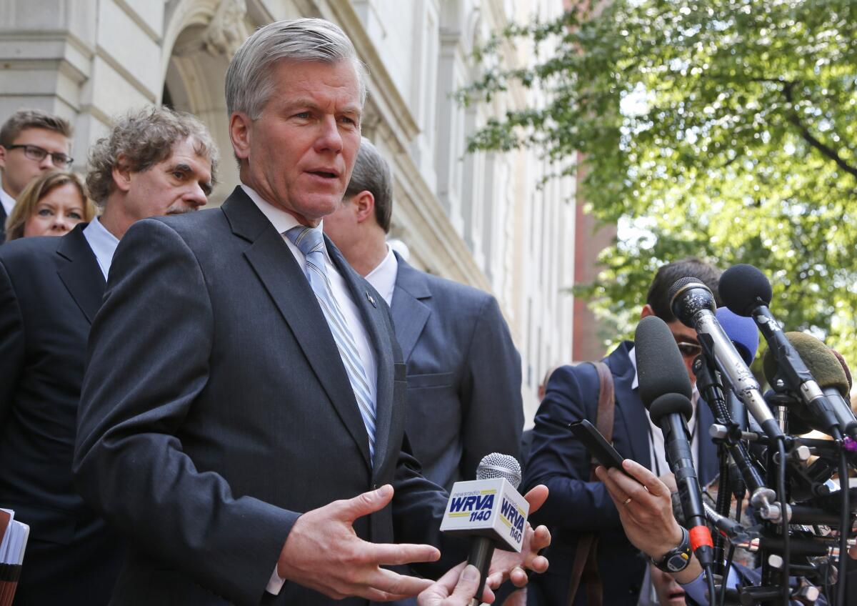 Former Virginia Gov. Bob McDonnell answers questions as he leaves the 4th U.S. Circuit Court of Appeals in Richmond, Va., on May 12.