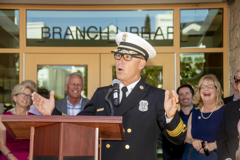 Newport Beach Fire Chief Chip Duncan speaks, commenting on the coincidence of the dedication with the moon walk 50 years ago. (Photo by Spencer Grant)