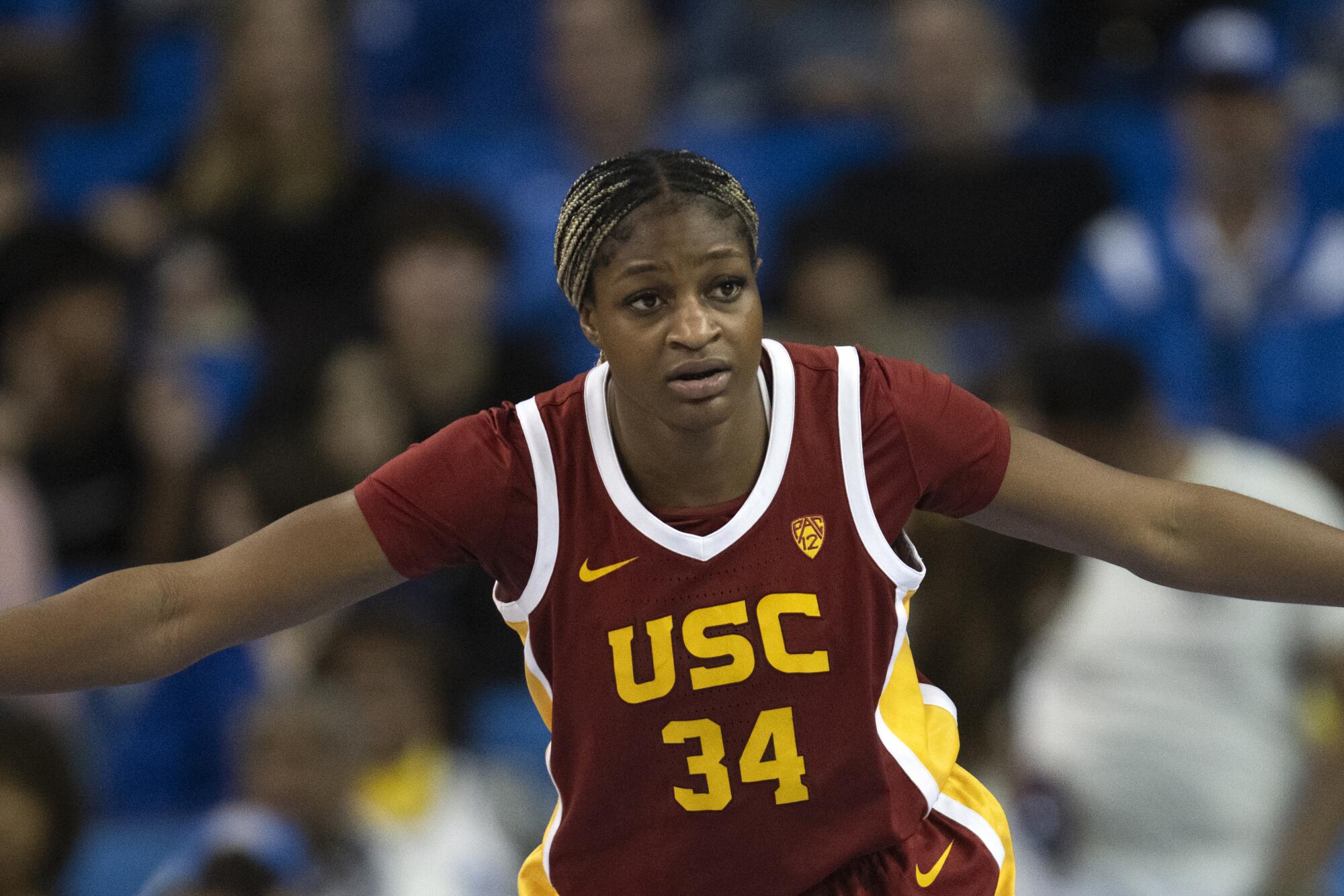 USC center Clarice Akunwafo gets down in a defensive stance.