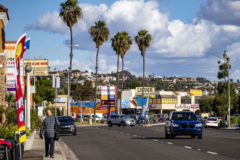 San Diego, CA - November 03: A person walks along Midway Drive in the Midway District on Thursday, Nov. 3, 2022 in San Diego, CA. (Meg McLaughlin / The San Diego Union-Tribune)