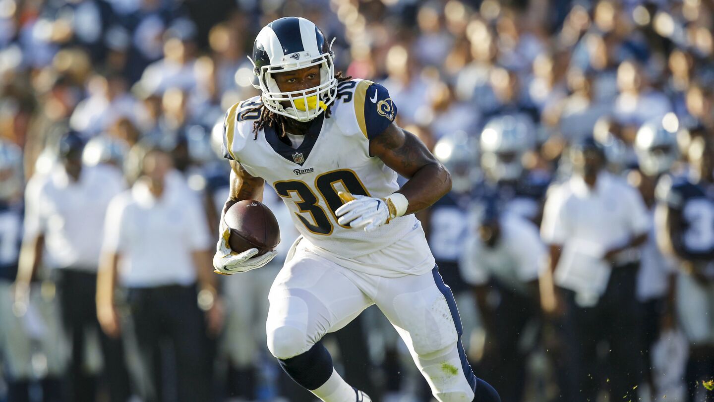 Rams running back Todd Gurley carries the ball during the first quarter of a preseason game against the Cowboys at the Coliseum.