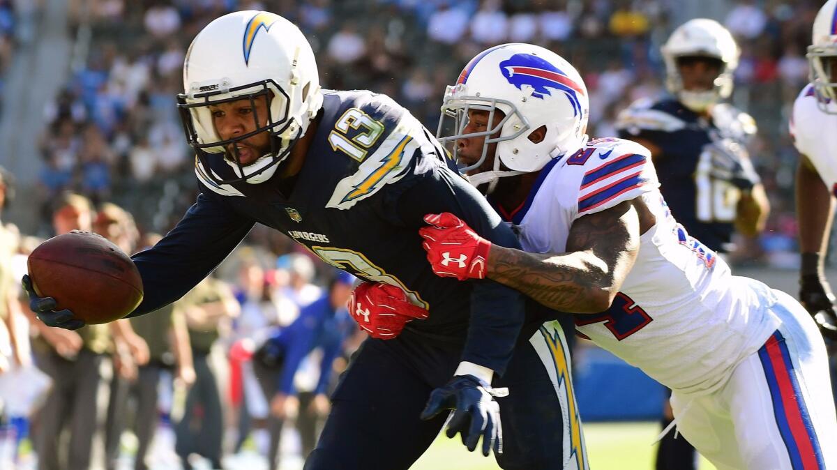 Keenan Allen of the Chargers stretches for a touchdown while being defended by Leonard Johnson of the Buffalo Bills during the second quarter.