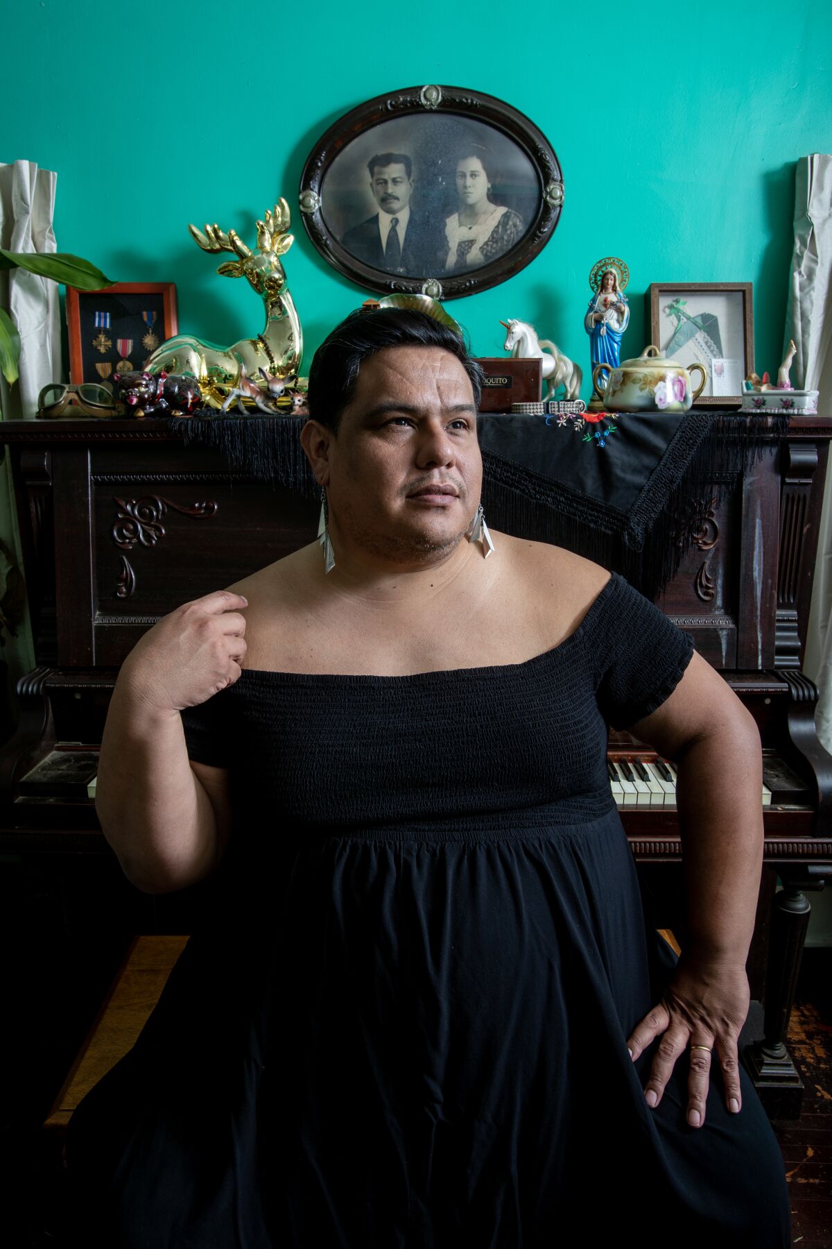 Dorian Wood sits at the piano bench.