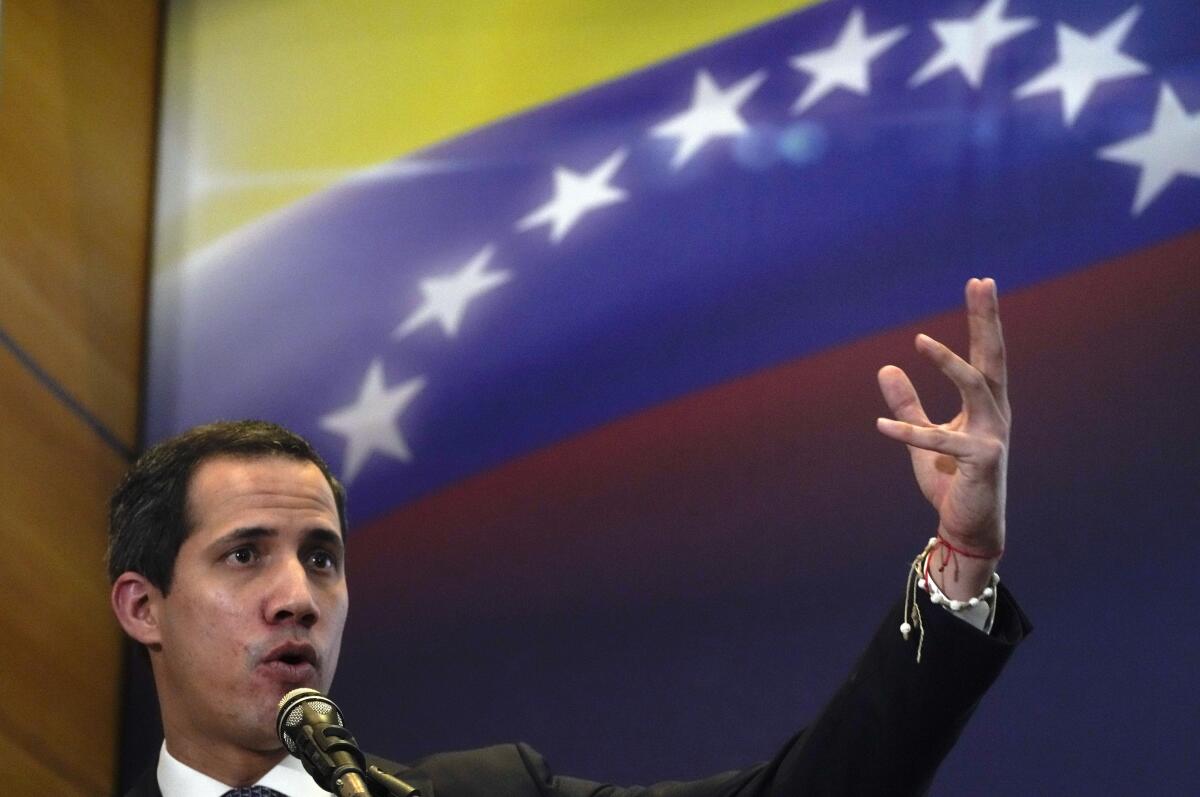 Opposition leader Juan Guaidó gestures as he speaks