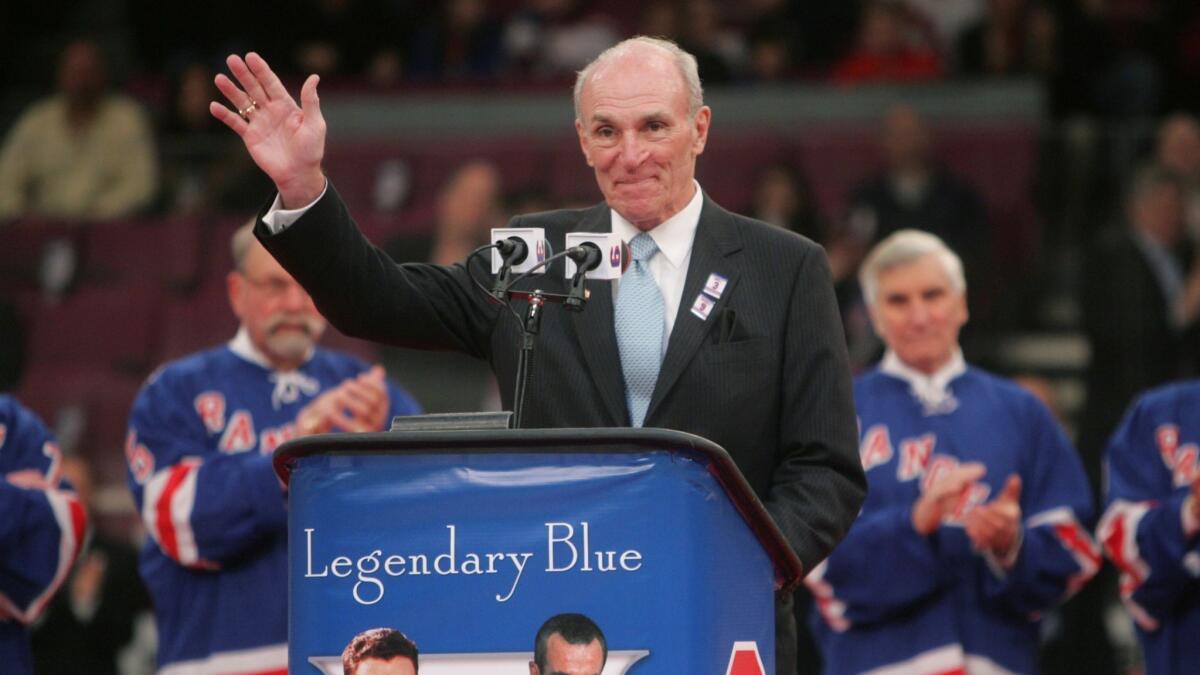 Harry Howell waves to the crowd during a ceremony to retire his number before a New York Rangers game on Feb. 22, 2009, at Madison Square Garden in New York.