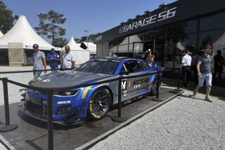 A replica of NASCAR’s Garage 56 Hendrick Motorsports entry is displayed at the 24 Hours of Le Mans in Le Mans, France, Thursday, June 8, 2023. NASCAR has arrived at the 24 Hours of Le Mans and even though its a specialized entry that can't race for the win, just being part of the biggest endurance race in the world has the industry buzzing to be part of the global stage. (AP Photo/Jenna Fryer)