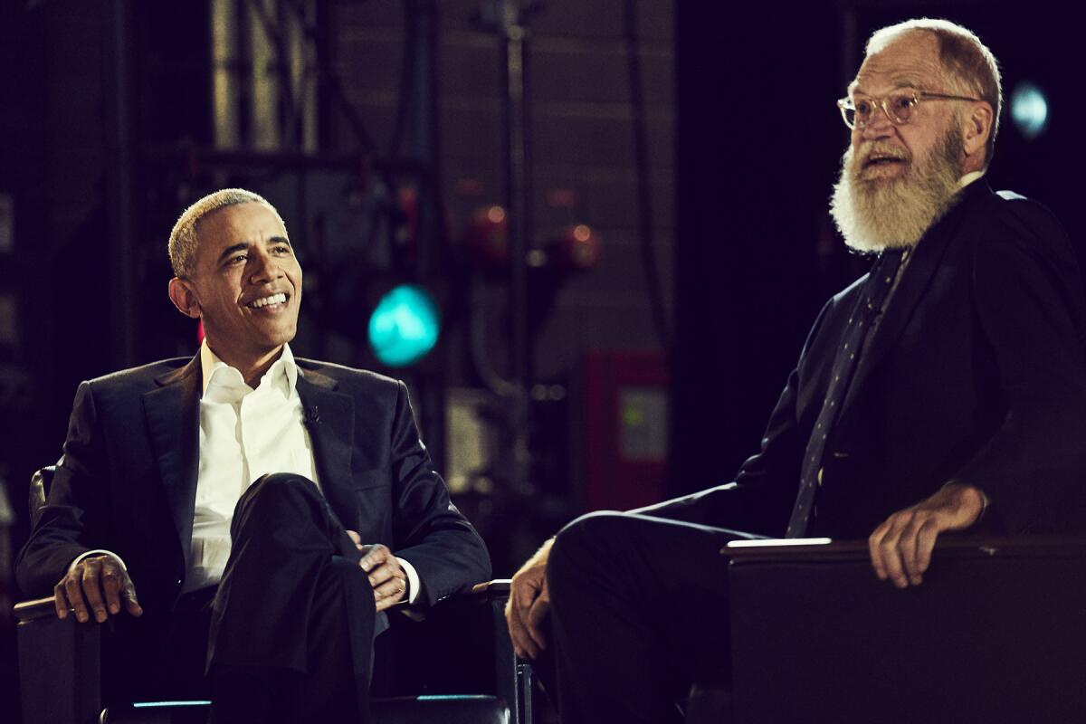 Former President Barack Obama and David Letterman sitting
