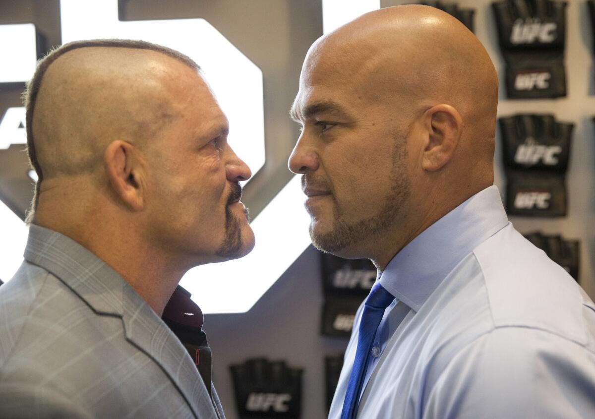 Mixed martial arts fighters Chuck Liddell, left, and Tito Ortiz face off during a red carpet event ahead of the UFC Hall of Fame ceremony at The Pearl at the Palms in Las Vegas on Thursday, July 5, 2018. (Richard Brian/Las Vegas Review-Journal via AP)