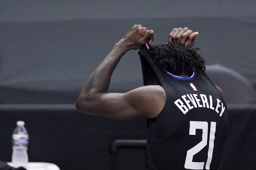 Los Angeles Clippers guard Patrick Beverley takes off his jersey after being ejected from Game 6 of the NBA basketball Western Conference Finals against the Phoenix Suns Wednesday, June 30, 2021, in Los Angeles. (AP Photo/Mark J. Terrill)