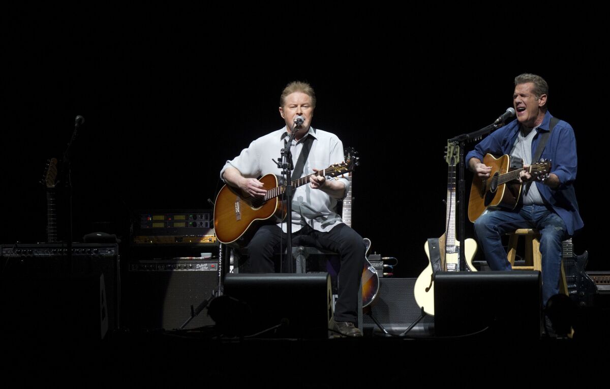 Don Henley, left, and Glenn Frey perform at the newly renovated Forum in January 2014. Frey died Monday at age 67 in New York City after a brief illness.