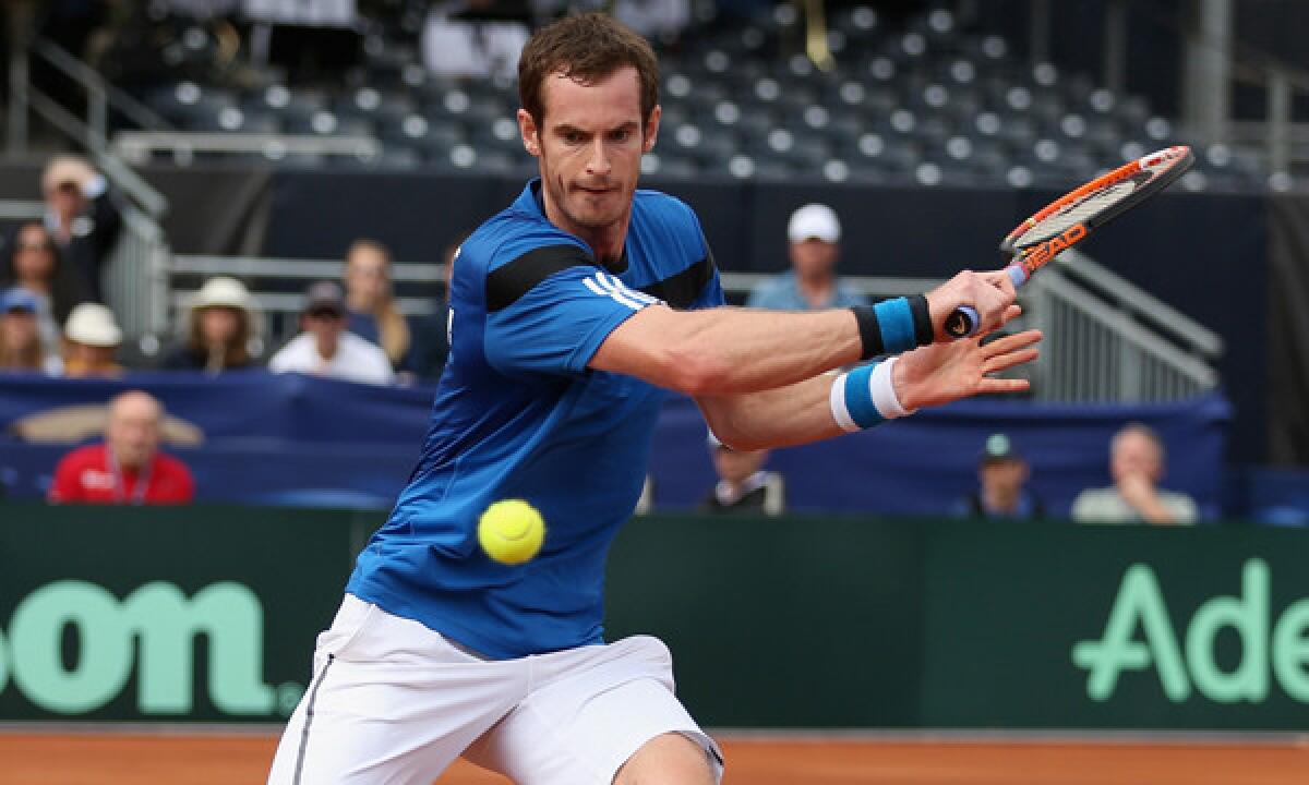 Andy Murray plays a backhand during his victory over Sam Querrey in a Davis Cup tournament match Sunday.