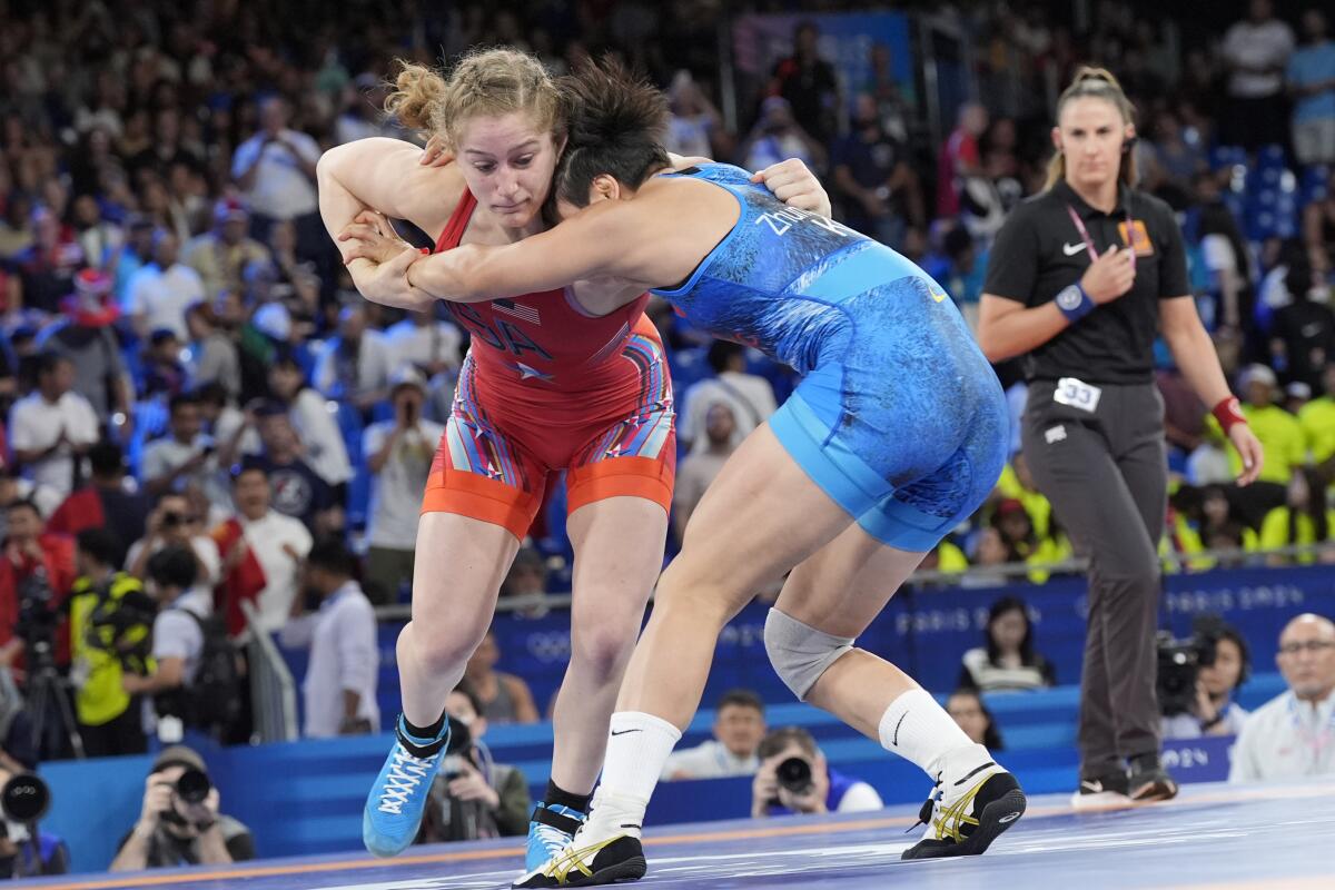 Amit Elor, left, and Kyrgyzstan's Meerim Zhumanazarova compete for the gold medal.