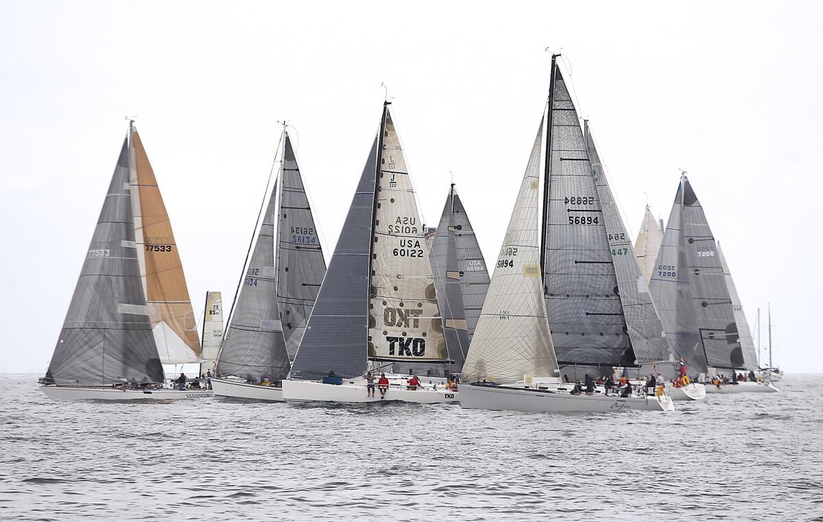 The TKO and the Pacifico join other races in their class for the start of the PHRF class during the 68th annual Newport to Ensenada International Yacht Race in Newport Beach on Friday.