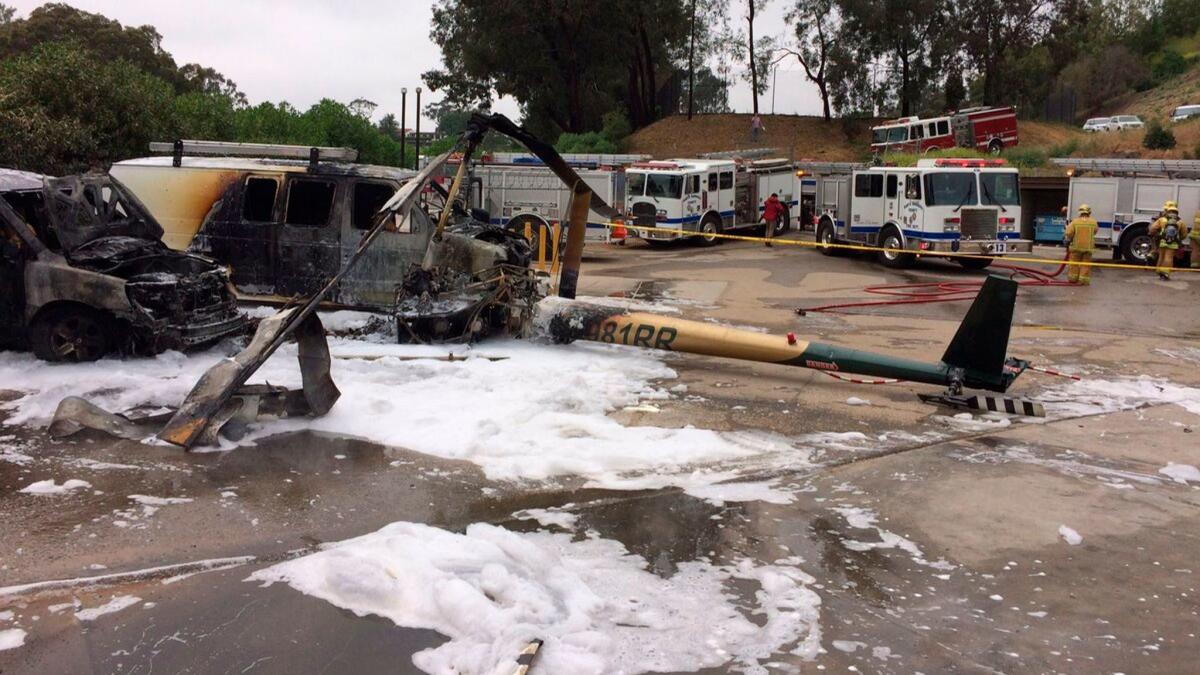 A Robinson R-44 helicopter returning from a tourist flight crashed and burned, injuring three passengers, in Santa Barbara on Friday.