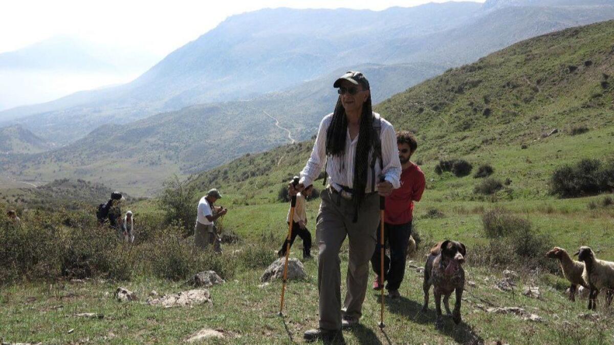 Kavous Seyed Emami is shown hiking in a photo provided by his family.