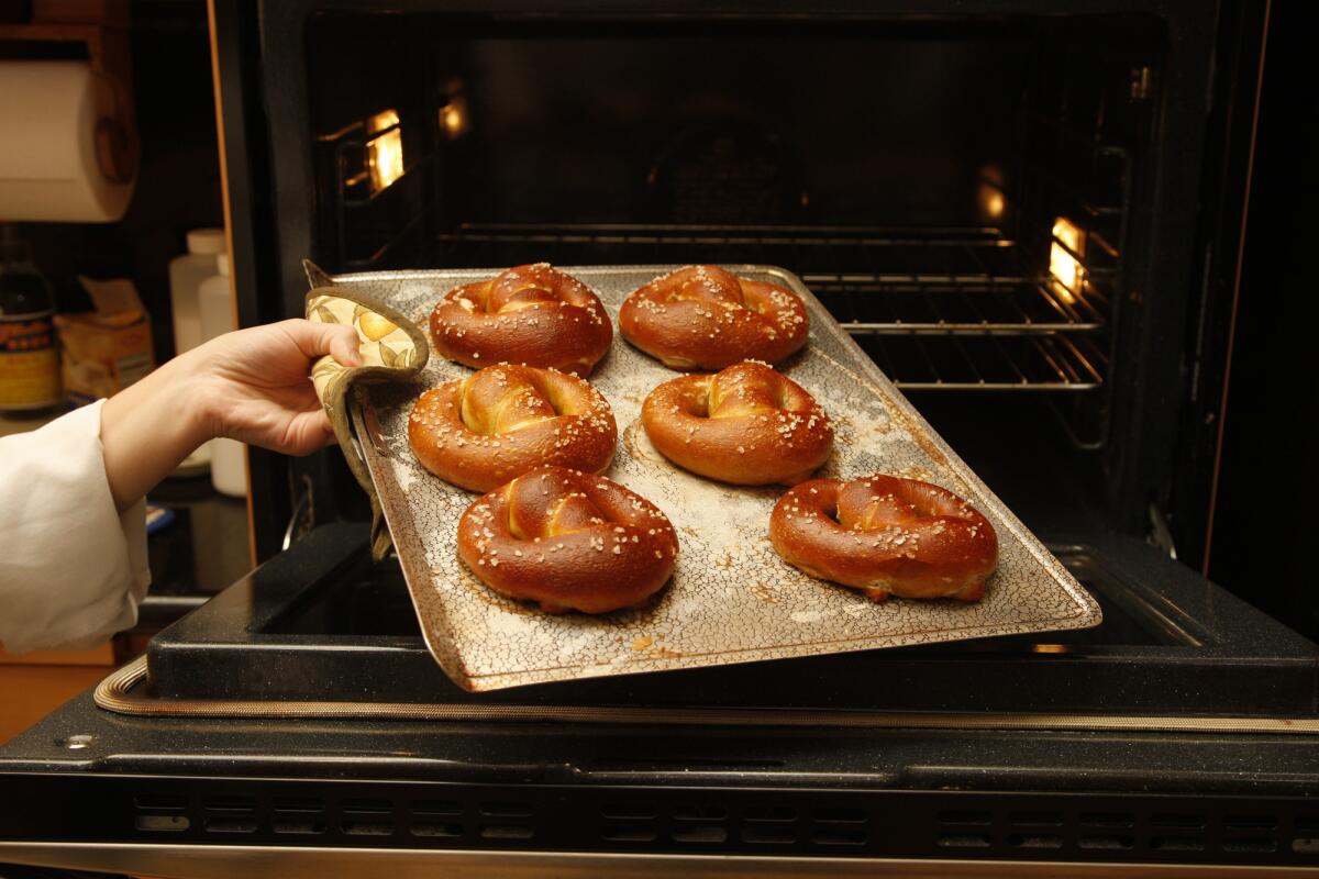 Bake pretzels until puffed and golden brown, about 10 minutes, rotating halfway.