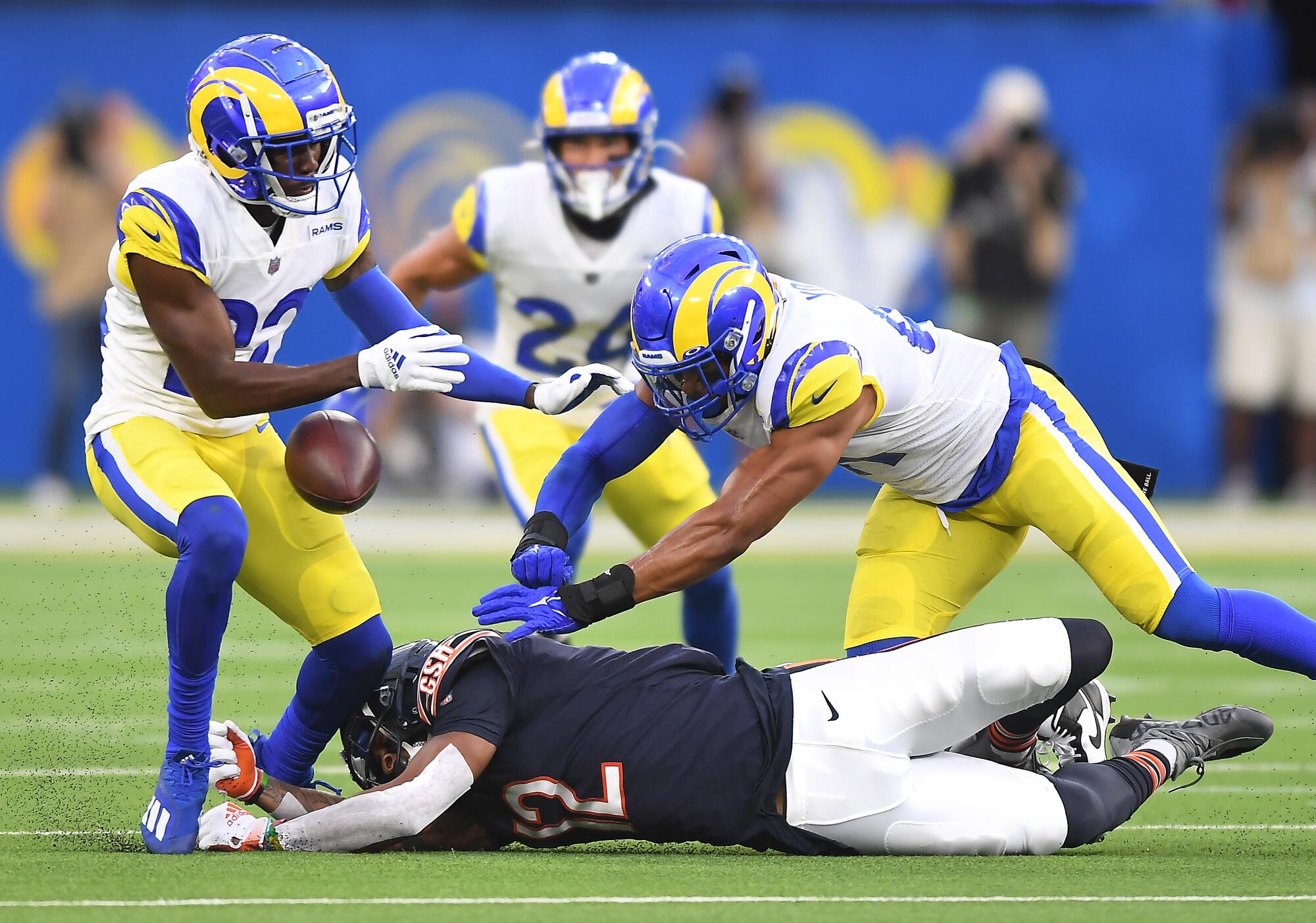 Los Angeles Rams David Long Jr., left, and Kenny Young prevent Chicago Bears receiver Allen Robinson from catching the ball
