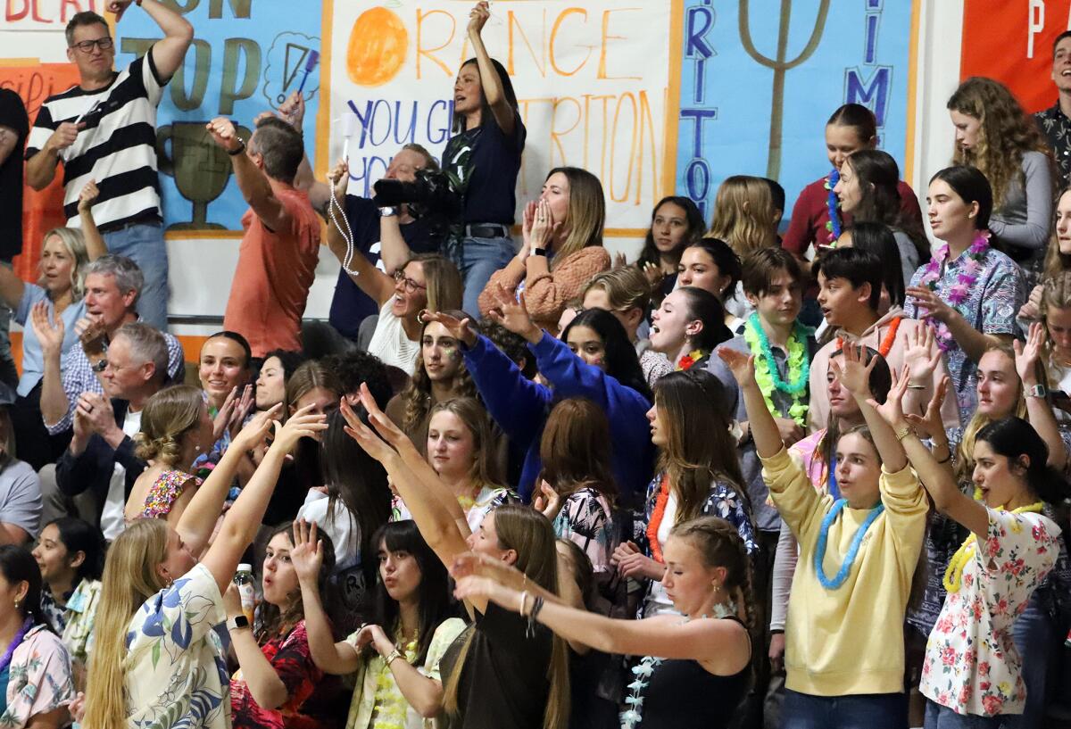 Pacifica Christian students and parents cheer for their boys' volleyball team against Sage Hill on Friday.