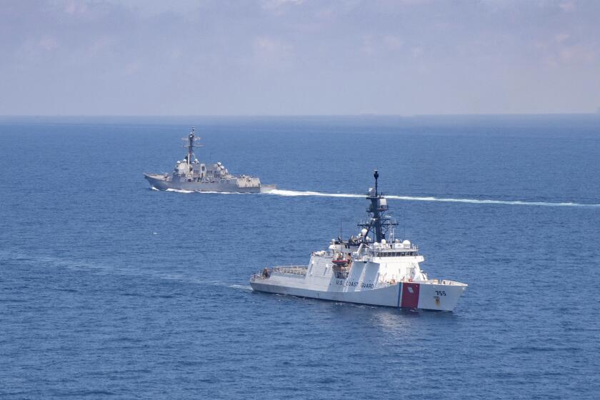FILE - In this Aug. 27, 2021, file photo provided by U.S. Coast Guard, Legend-class U.S. Coast Guard National Security Cutter Munro (WMSL 755) transits the Taiwan Strait during a routine transit with Arleigh Burke class guided-missile destroyer USS Kidd (DDG 100). North Korea on Saturday, Oct. 23, accused the Biden administration of raising military tensions with China with its “reckless” backing of Taiwan and claimed that the growing U.S. military presence in the region poses a potential threat to the North.(U.S. Coast Guard via AP, File)