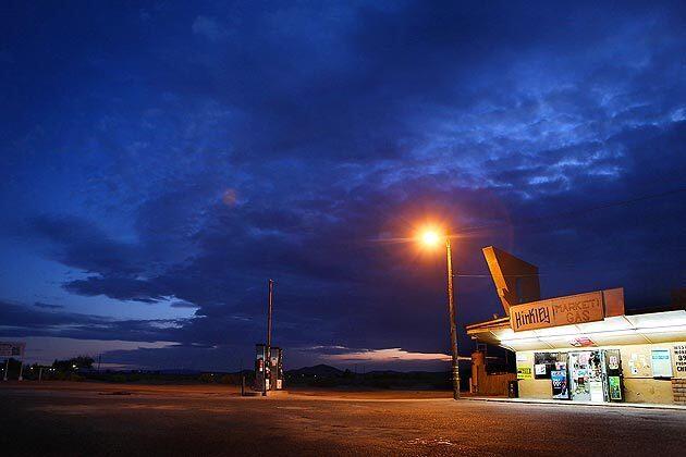 Night falls on the Hinkley Market and Gas, whose owner worries that if enough residents sell their homes to Pacific Gas & Electric, he will not have enough customers left to stay in business. PG&E has offered to buy out 314 homeowners who live within a mile of a chromium-tainted plume of groundwater.
