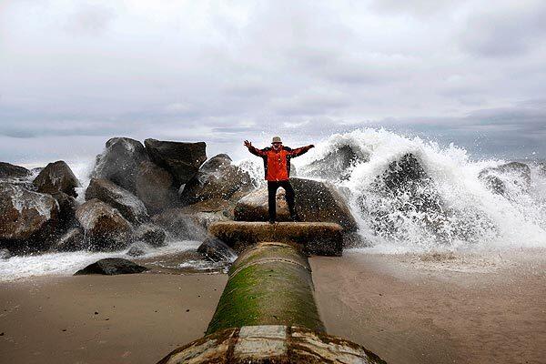 "Life is all about enjoying the day completely," Beyonda Love, 70, said while dancing with the crashing waves as a backdrop in Venice on Monday. Love calls his beach trips his "recess at the University of Venice."