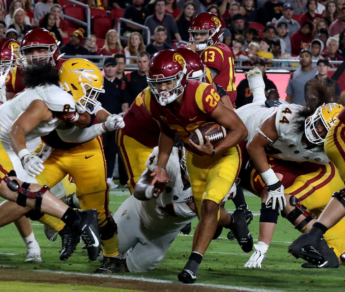 Travis Dye carries the ball into the end zone for USC.