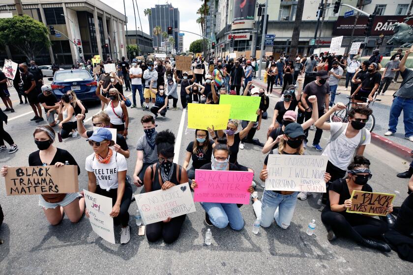 HOLLYWOOD CA. JUNE 1, 2020 - More than 1,000 demonstrators, many holding signs, gathered at Hollywood Boulevard and Vine Street late Tuesday morning to protest the death of George Floyd at the hands of police. (Al Seib / Los Angeles Times)