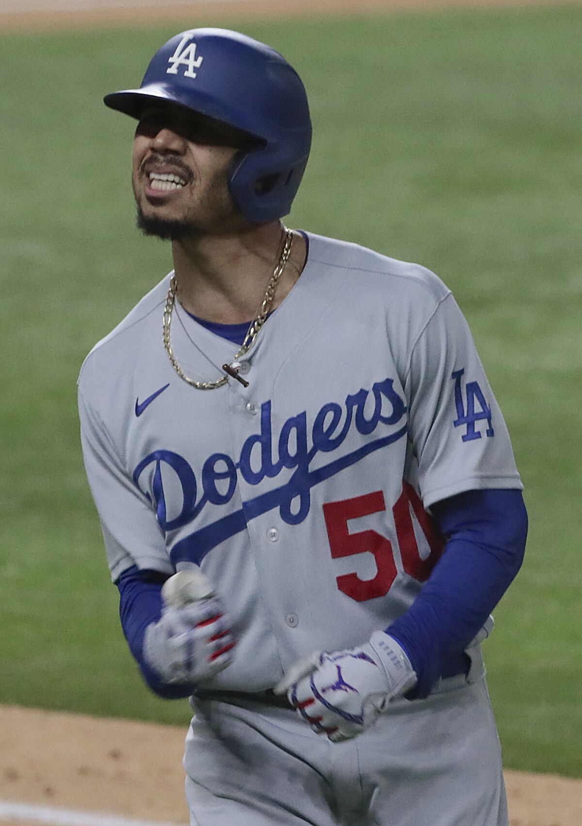 Dodgers right fielder Mookie Betts expresses frustration after lining out to right field.