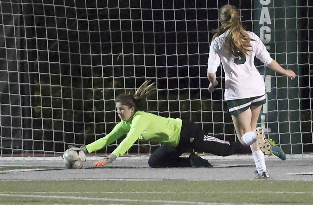 Sage Hill goalie Sarah Lowey dives to make the save against Crean Lutheran on Thursday at Sage Hill.