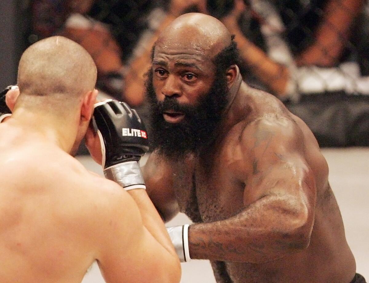 In this May 31, 2008, file photo, Kimbo Slice, right, battles James Thompson of Manchester, England during their EliteXC heavyweight bout at the Prudential Center in Newark, N.J.