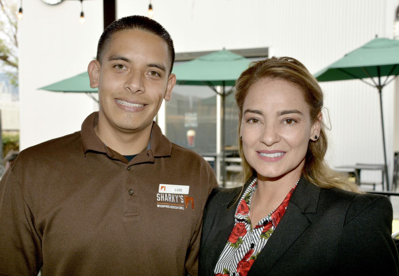 Chamber of Commerce members were welcomed to last week's mixer by Luis Carmona of Sharky's Woodfired Mexican Grill and chamber board Chairwoman Gema Sanchez.