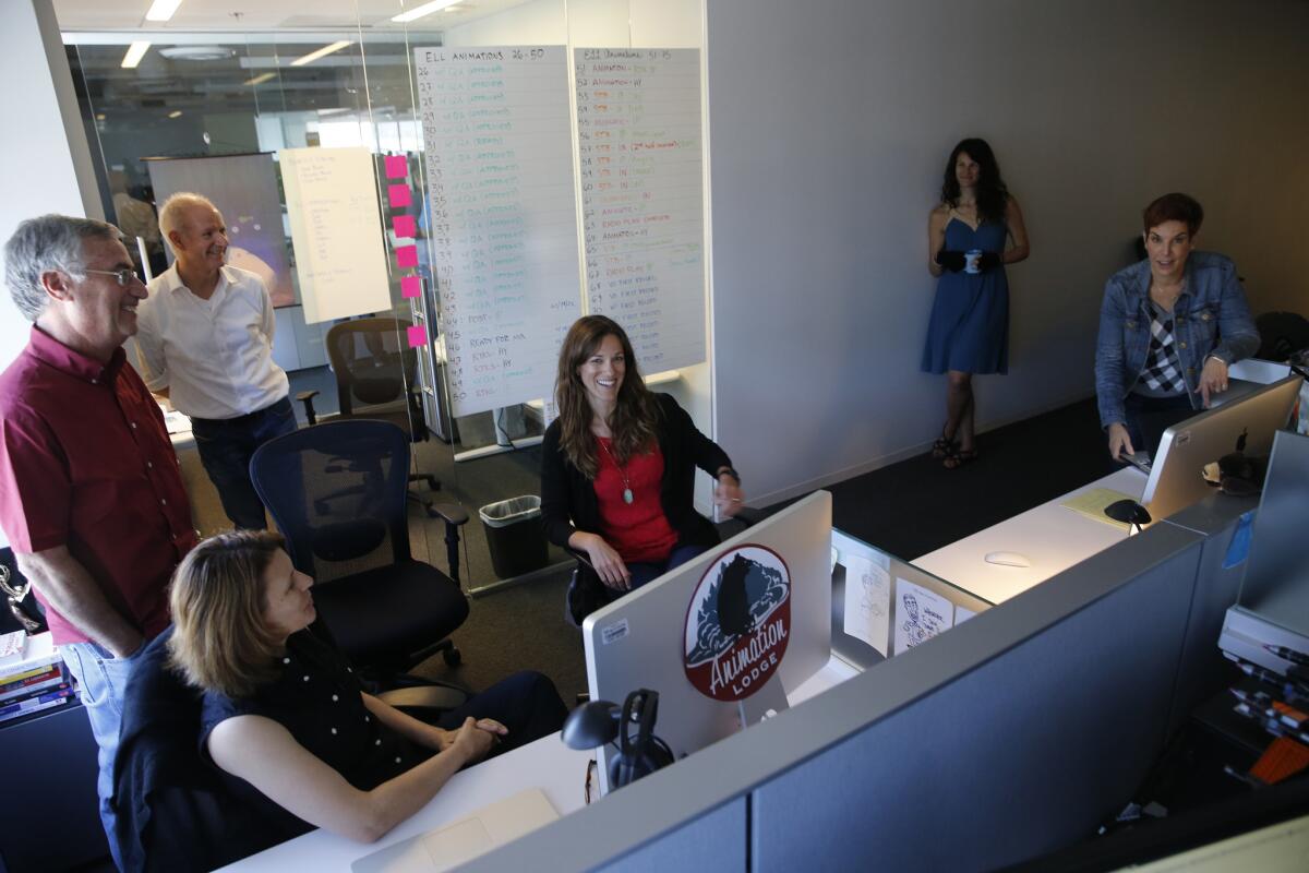 Members of the content team review a new animation Age of Learning. (Allen J. Schaben / Los Angeles Times)
