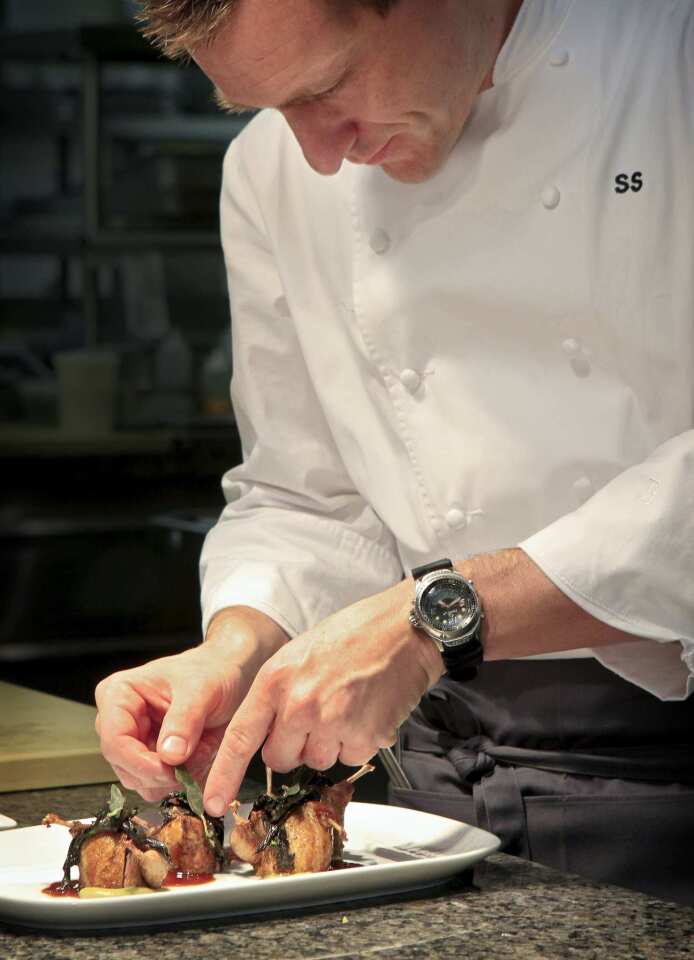 Executive chef Sonny Sweetman preparing Wolfe Ranch quail.