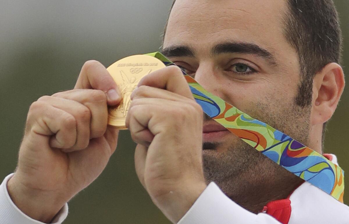 Josip Glasnovic shows off his gold medal.