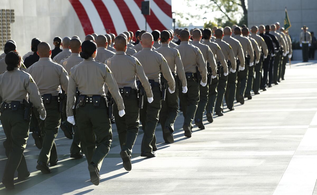 An L.A. County sheriff’s deputy has been charged with operating a large-scale drug trafficking operation in which he said that he had other law enforcement officers on his payroll, federal authorities allege.