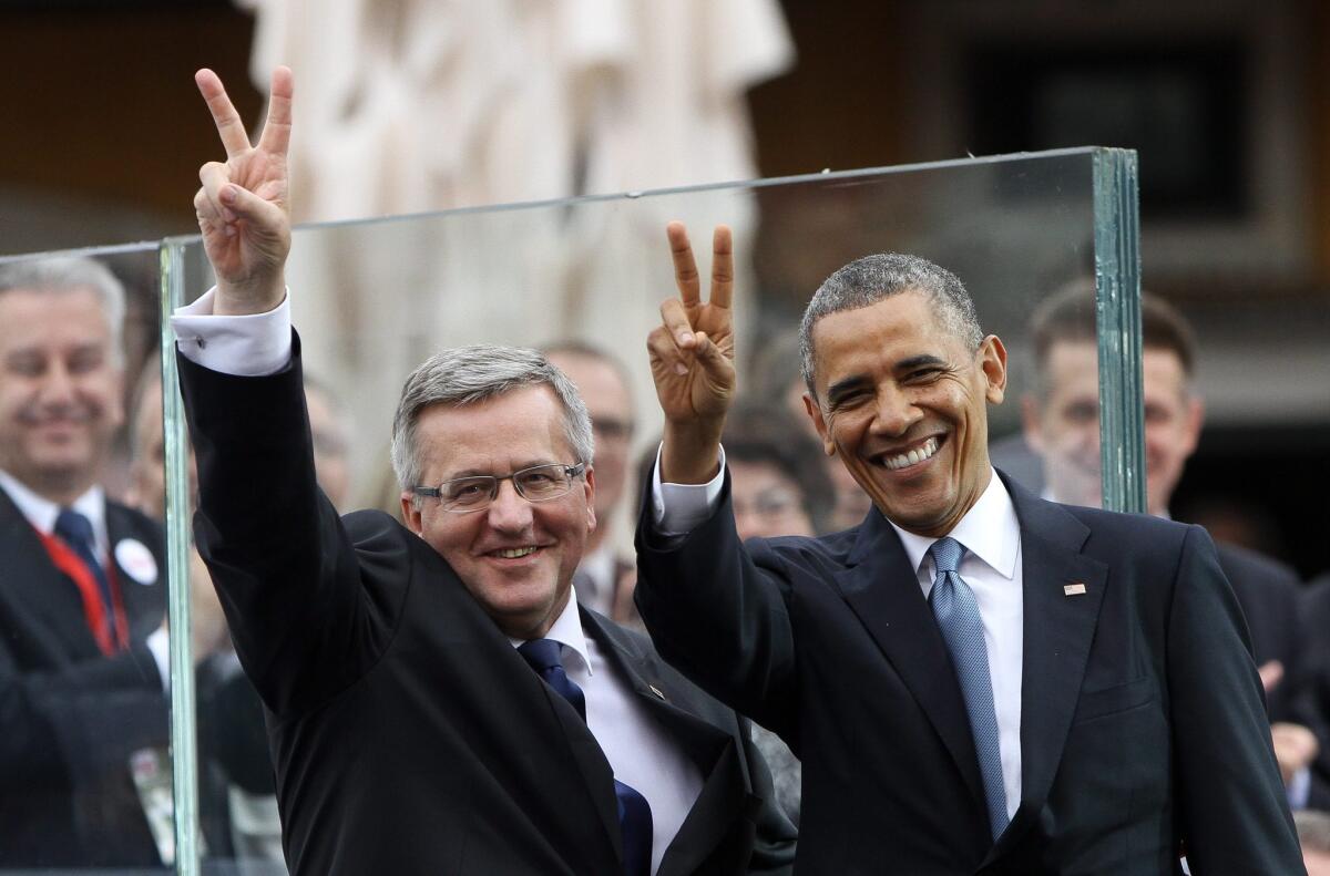 President Obama and Polish President Bronislaw Komorowski attend Freedom Day celebrations in Warsaw on the 25th anniversary of Poland's first Western-style elections.
