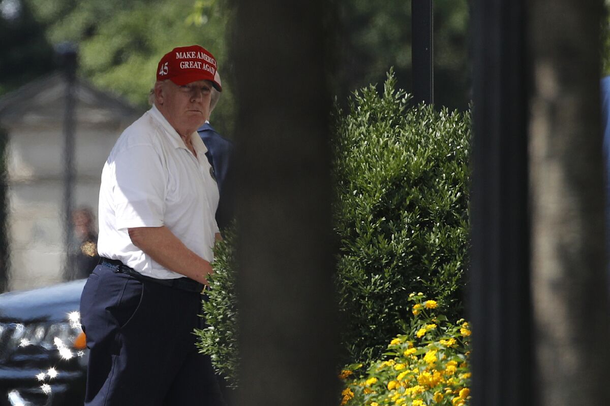 President Trump arrives at the White House on Sunday after visiting Trump National Golf Club in Sterling, Va. 