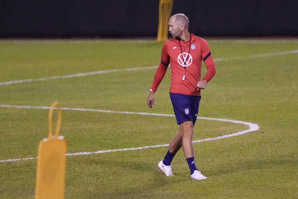 United States head coach Gregg Berhalter walks on the pitch during a training session ahead of the FIFA World Cup Qatar 2022 qualifying soccer match between Honduras and the United States in San Pedro Sula, Honduras, Tuesday, Sept. 7, 2021. (AP Photo/Moises Castillo)