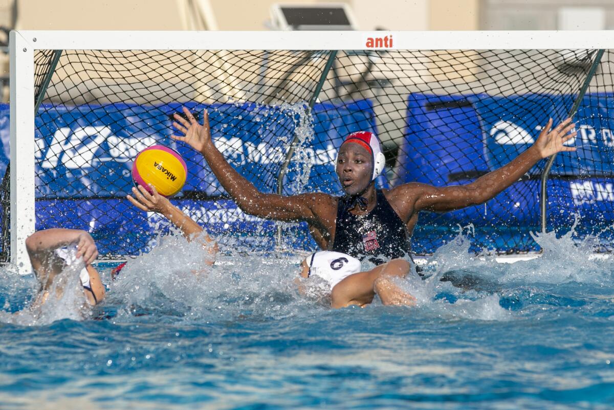 U.S. women's goalkeeper Ashleigh Johnson looks to block a shot during Wednesday's exhibition match against Spain.