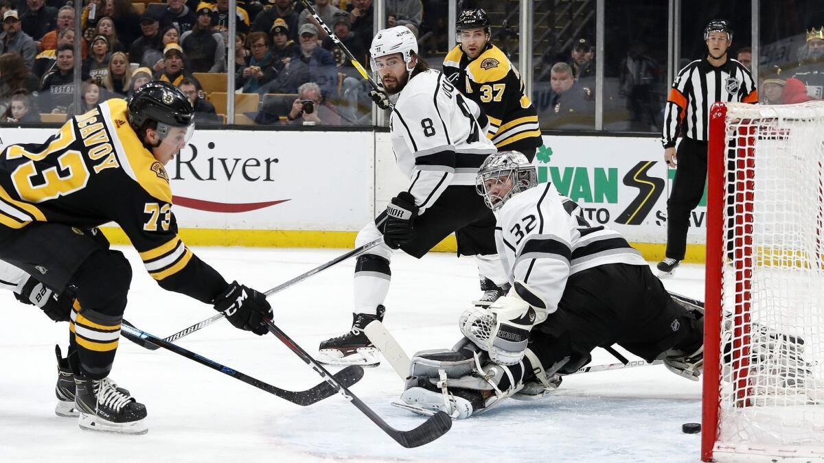 Boston Bruins' Charlie McAvoy (73) scores past Kings goaltender Jonathan Quick during the second period.
