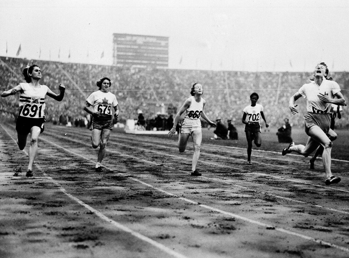 FILE - In this Aug. 2, 1948 file photo, Fanny Blankers-Koen, right, of Holland crosses the finish line in 11.9 seconds to win the Women's 100-meter Dash Final in the Olympic Games at Wembley Stadium, Eng. Britain's D. G. Manley (691) is second, Australia's S. B. Strickland (668) third Canada's V. Myers , hidden by camera finishes fourth while teammate Pat Jones (679) finished fifth, and Jamaica's E. Thompson (702) finished sixth. Women were limited in what they could do at the 1948 London Olympics so it was ironic that the biggest personality was a mother of two. Fanny Blankers-Koen was 30, the oldest woman among the track and field entries and considered past her prime. But she won the 100 and 200 meters, the 80-meter hurdles and the 4x100-meter relay. She remains the only female track and field athlete to win four gold medals at a single Olympics. (AP Photo, File)