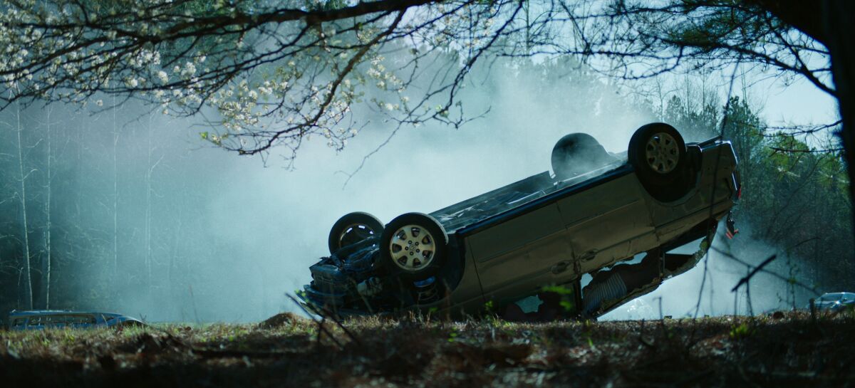 A car rests on its hood after a crash in a scene from "Ozark."