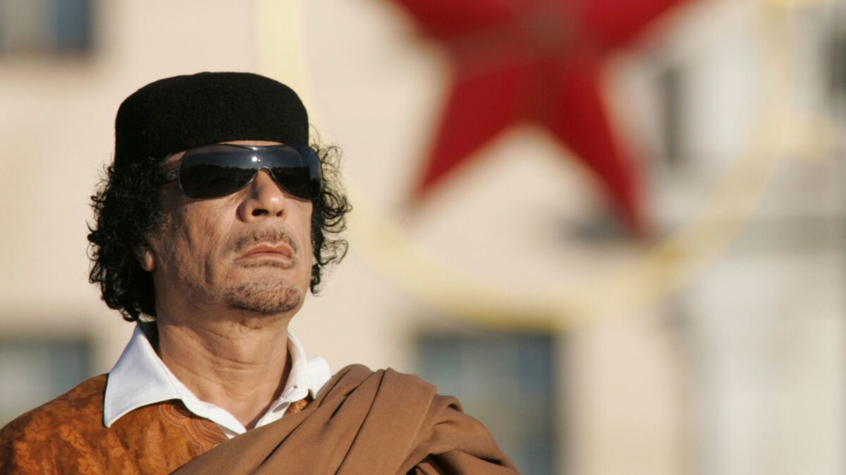 Libyan leader Moammar Kadafi attends a wreath-laying ceremony in the Belarus capital, Minsk, on Nov. 3, 2008.