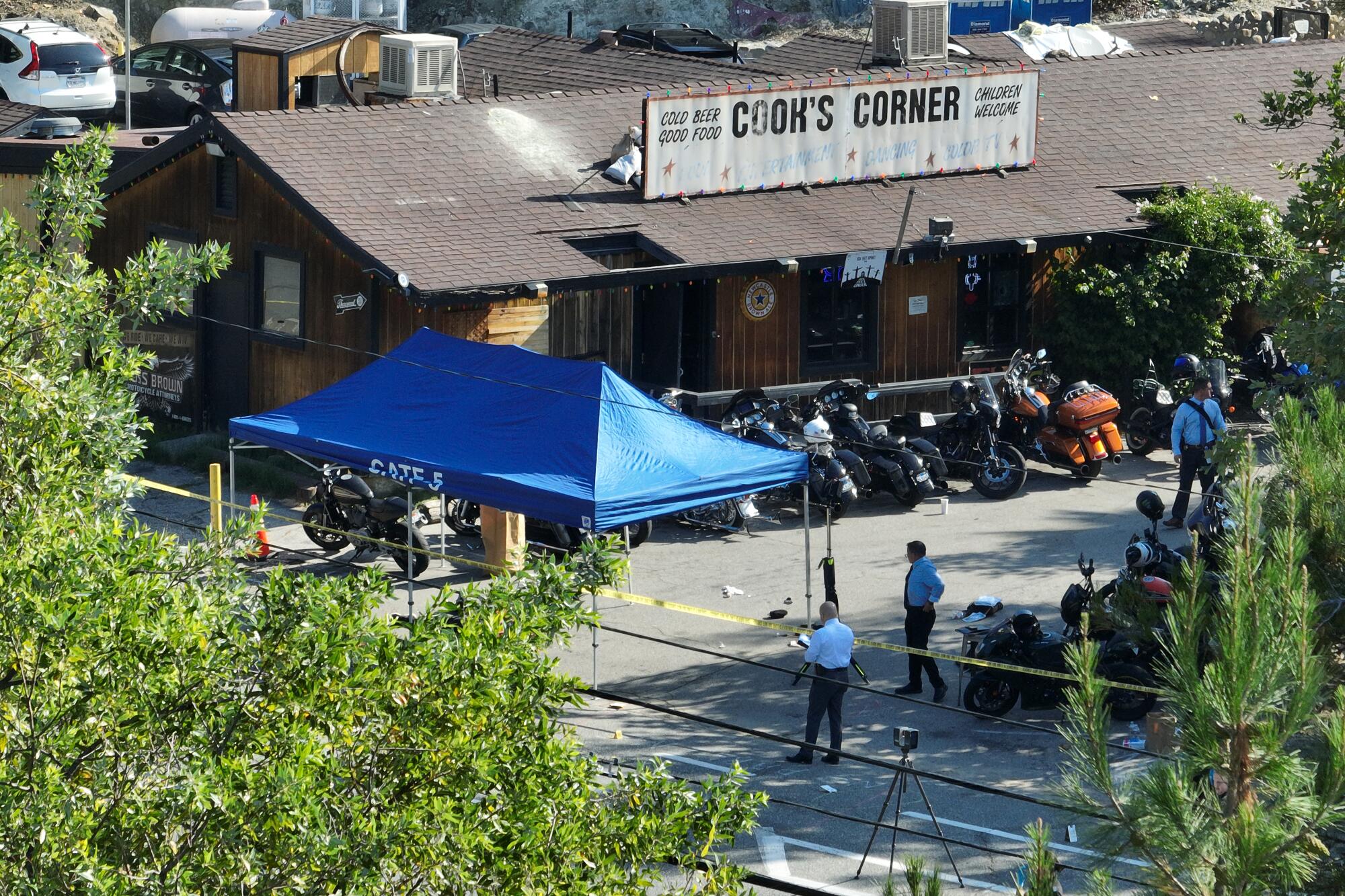 An aerial view of investigators at Cook's Corner bar in Trabuco Canyon, scene of Wednesday's mass shooting 