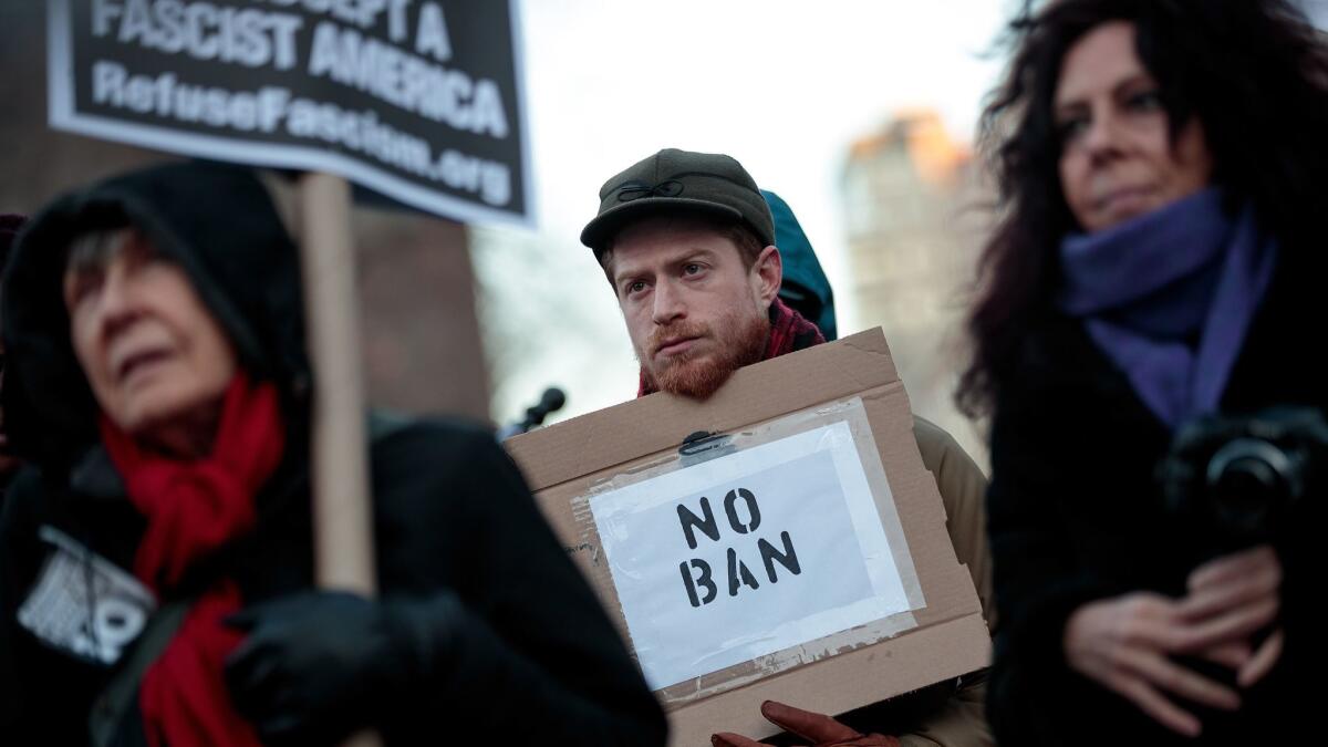 Demonstrators in New York on Thursday protest President Trump's proposed travel ban.