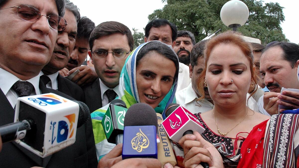 Mukhtar Mai, center, photographed in 2005 talking to media after Supreme Court proceedings in Islamabad, Pakistan.
