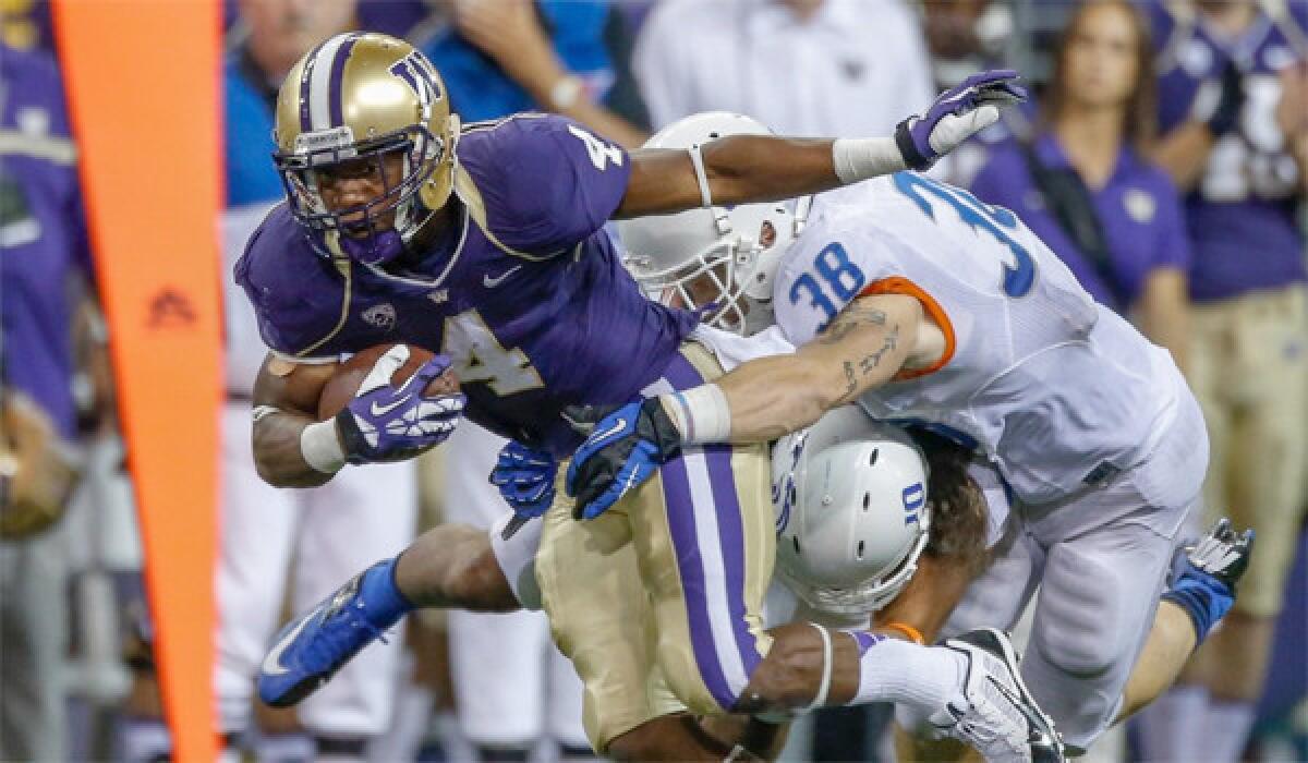 Washington's Jaydon Mickens rushes against Boise State during the Huskies' win over the Broncos, 38-6.